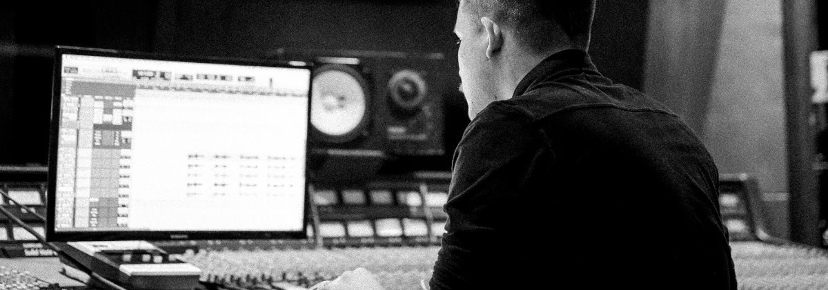 Audio engineer’s desk with studio monitors used for mastering