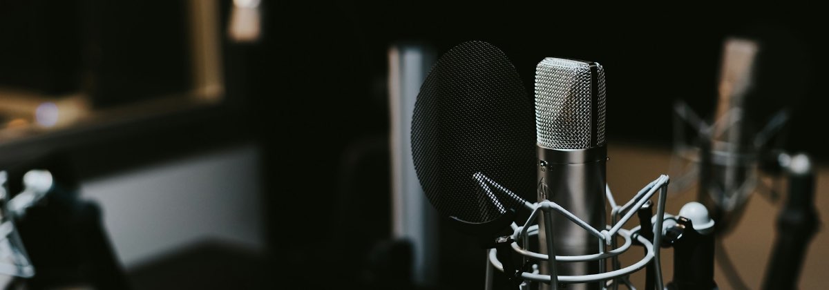 Studio condenser microphone set up to record a single voice