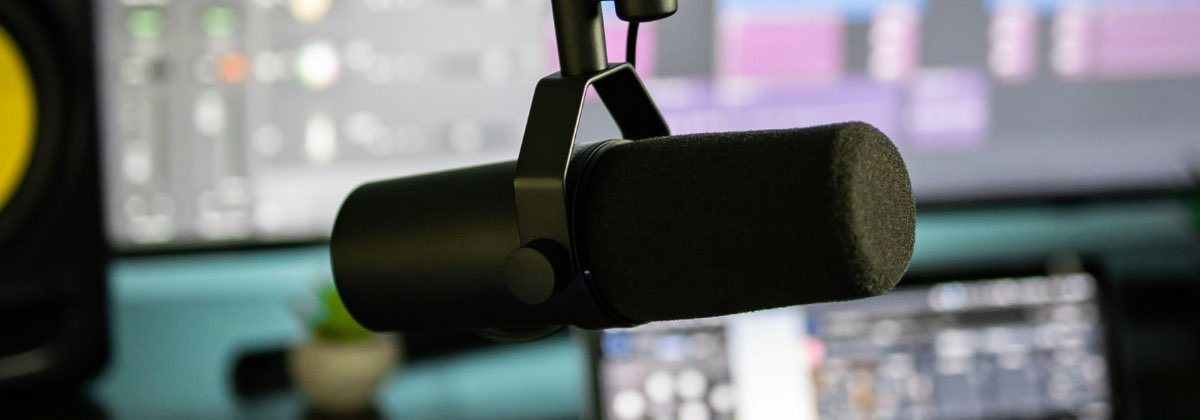 Podcast microphone on a desk, ready for a spoken-word recording